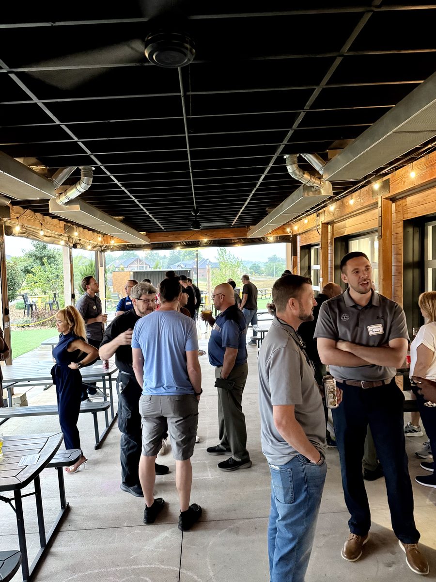 Covered patio networking at the 2025 CREID Self Storage Mixer